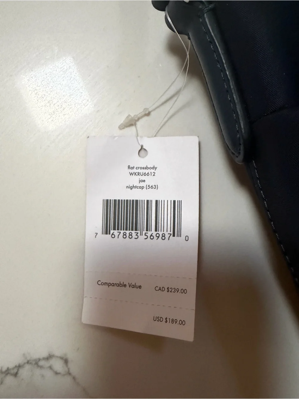kate spade navy blue nylon crossbody with gold logo